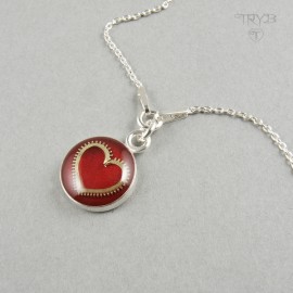 Sterling silver necklace with heart of a watch gear