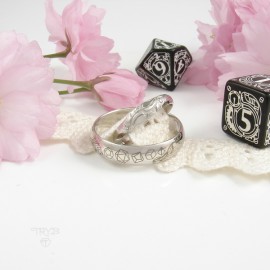 Custom made white gold wedding bands with leaves and dices